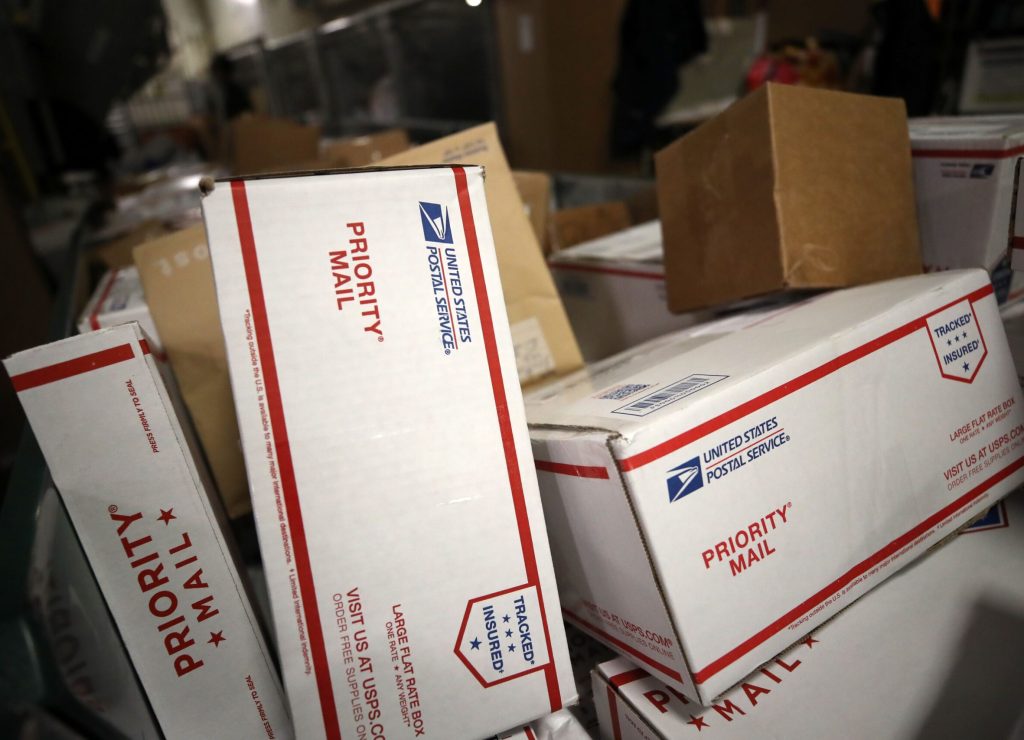 postal-service-priority-mail-boxes-move-on-a-conveyor-belt-news-photo-1650906277